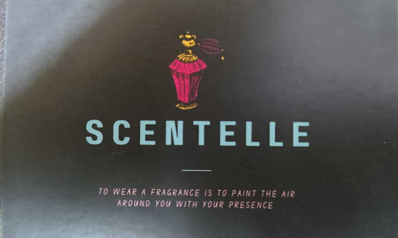 The Scentelle brand card: the atomiser logo mark above the wordmark and tagline